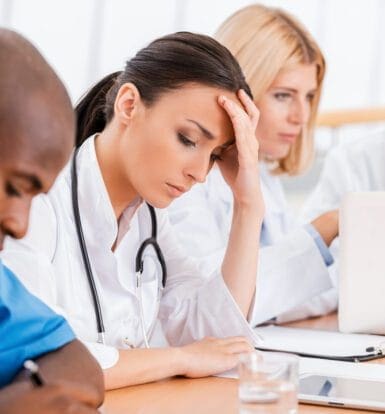 Healthcare providers reviewing paperwork for prior authorization of Buspirone HCL with Express Scripts.