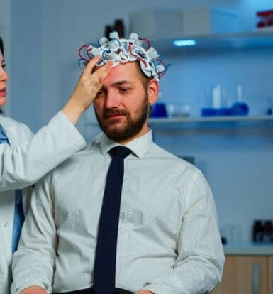 Healthcare provider conducting a neurological evaluation on a patient using advanced equipment in a clinical setting.