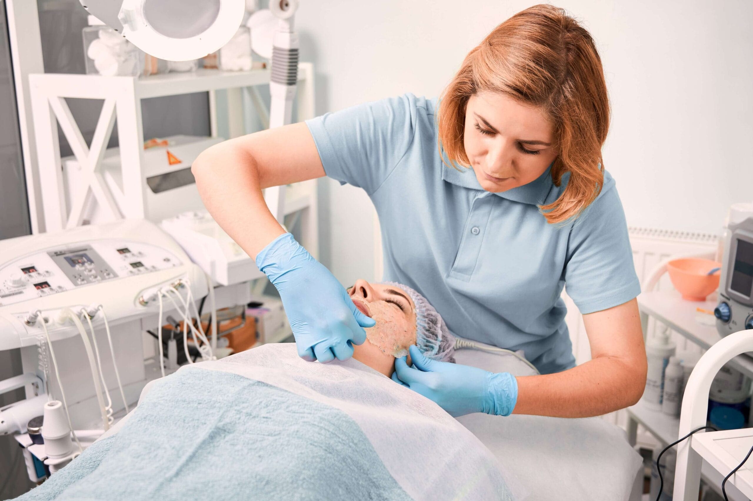 Healthcare professional performing a treatment on a patient in a clinical setting for prior authorization purposes.