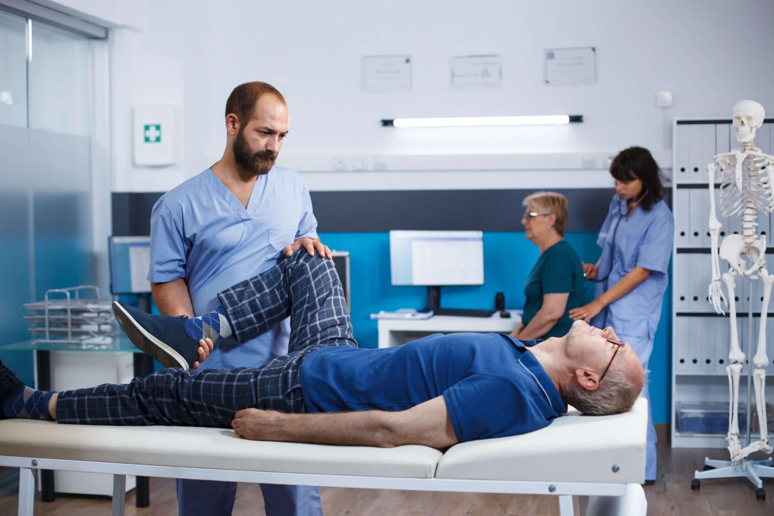 Physical therapist assisting a patient with neuralgia in a clinical setting, representing the process of prior authorization for Horizant.