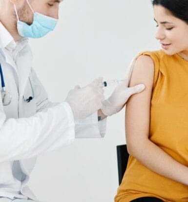 Doctor administering an injection to a patient, symbolizing diabetes management with injectable medications like Ozempic
