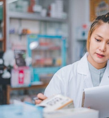 LTC pharmacy staff reviewing billing data with outsourcing experts.