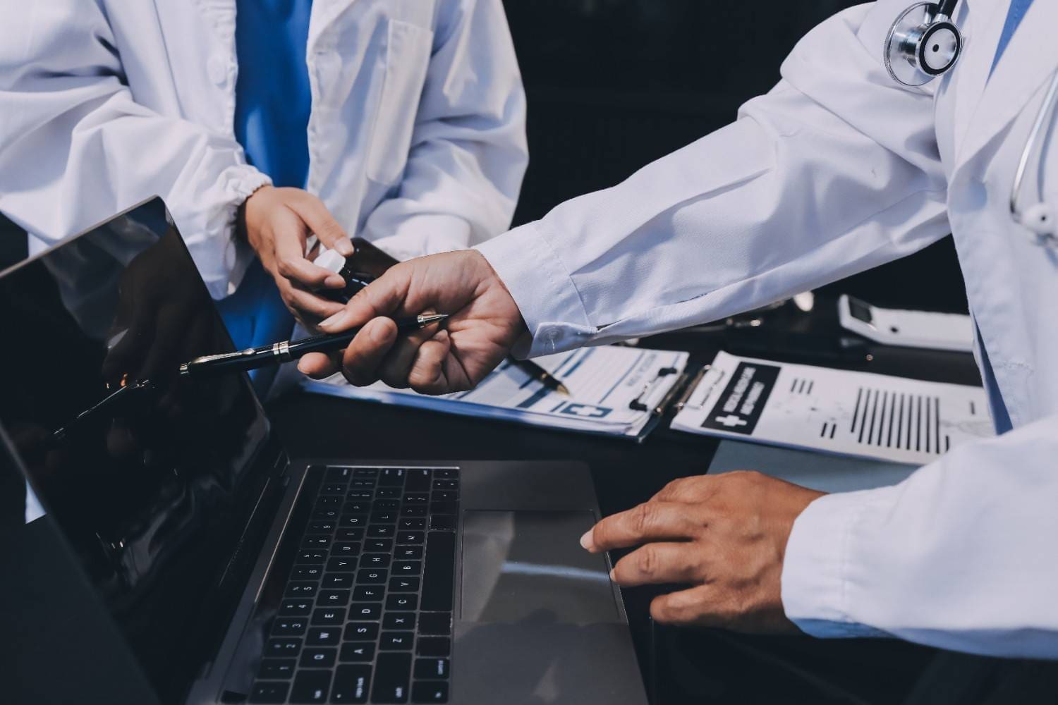 A medical coder reviewing patient files for accurate coding.