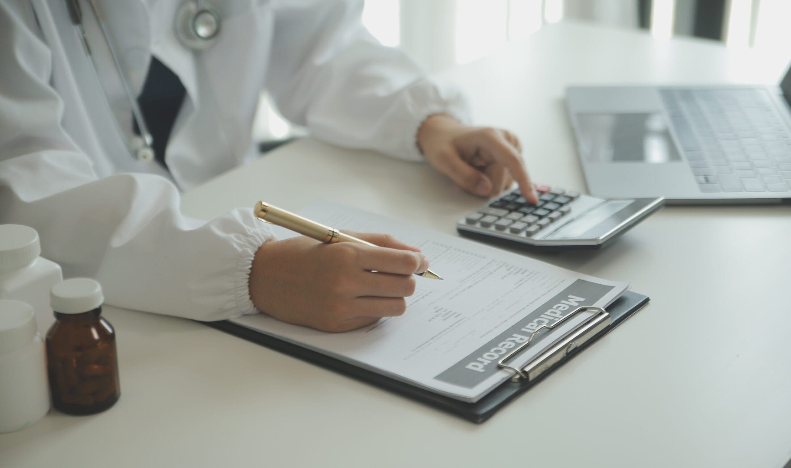 A medical coder analyzing data on a computer to ensure billing accuracy.