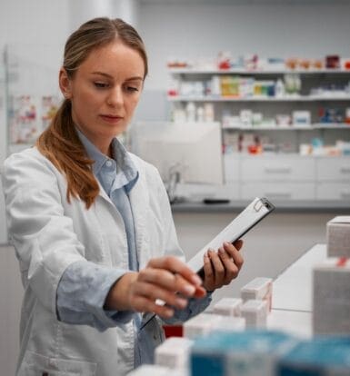 A healthcare professional using automated software for LTC pharmacy billing.