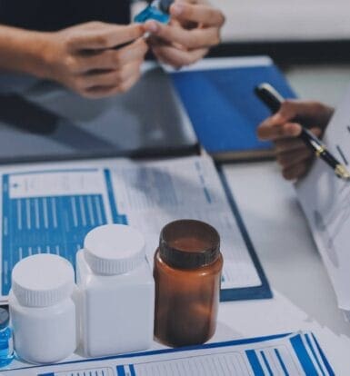 A pharmacist reviewing billing documents for long-term care services