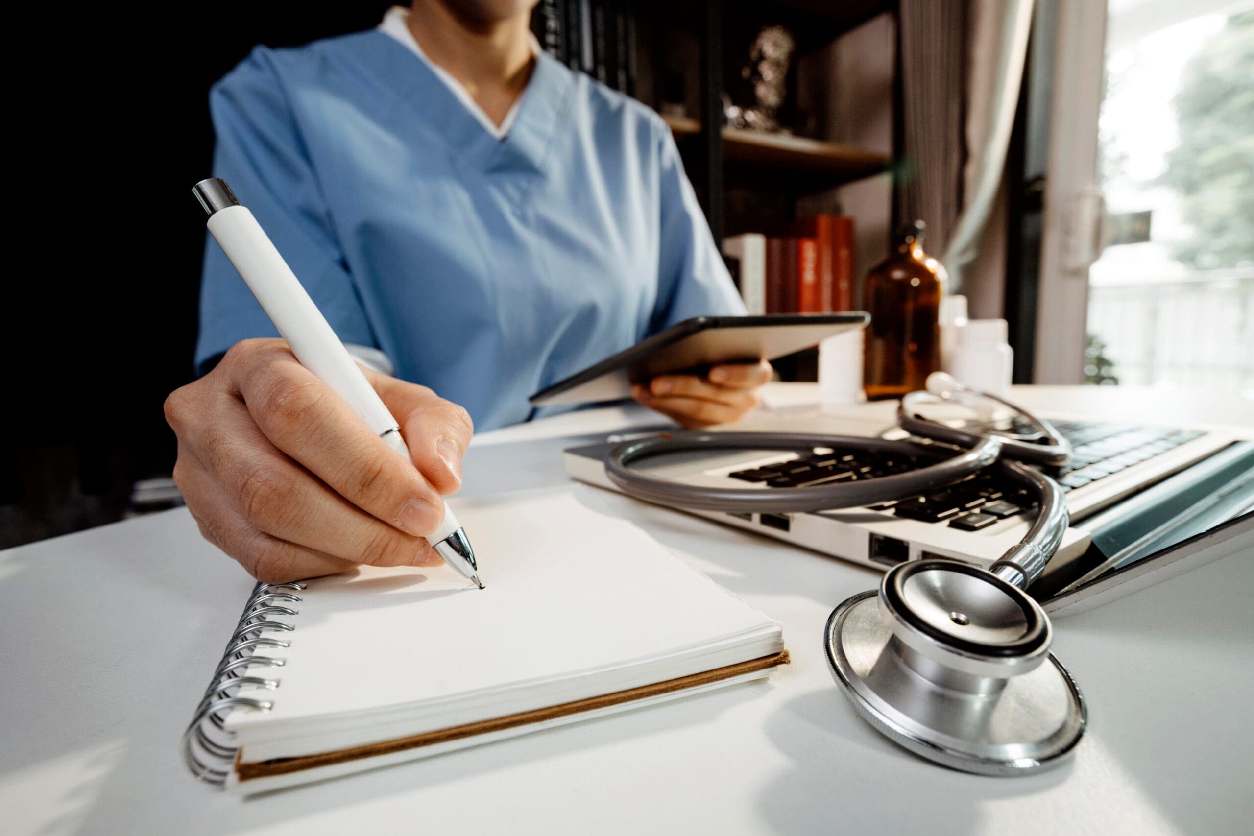 A medical scribe documenting a patient visit in real-time.
