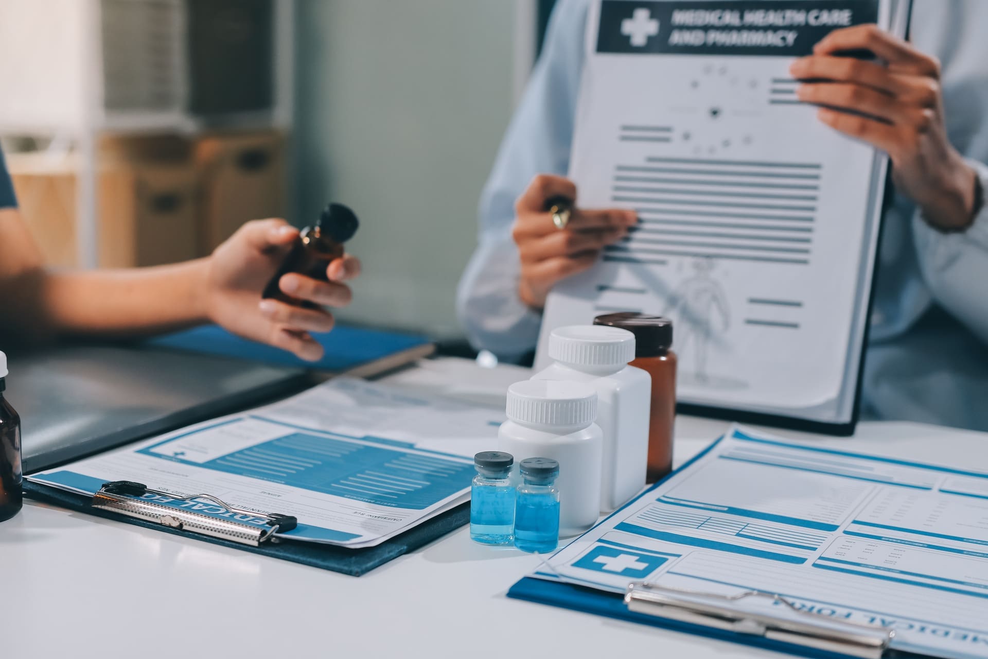 Doctor reviewing a patient’s medication list to expedite prior authorization in New York City