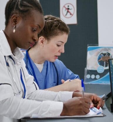 A certified medical coder reviewing patient records in New Jersey.