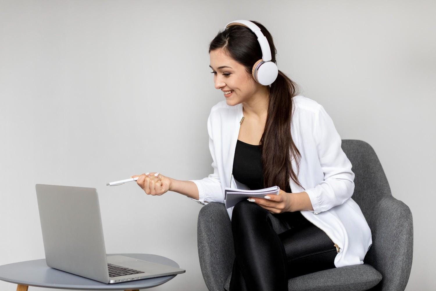 Healthcare Virtual Assistant Working Remotely with a Laptop and Headset