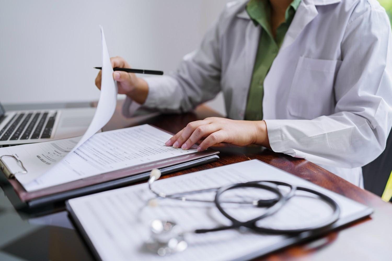 A healthcare provider reviewing medical coding data for compliance in Florida.