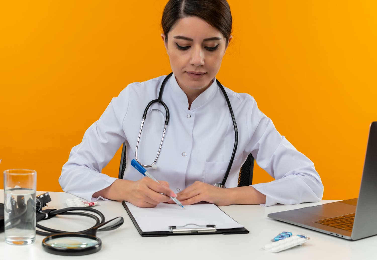 Medical coder reviewing patient data for compliance in New Jersey healthcare office.