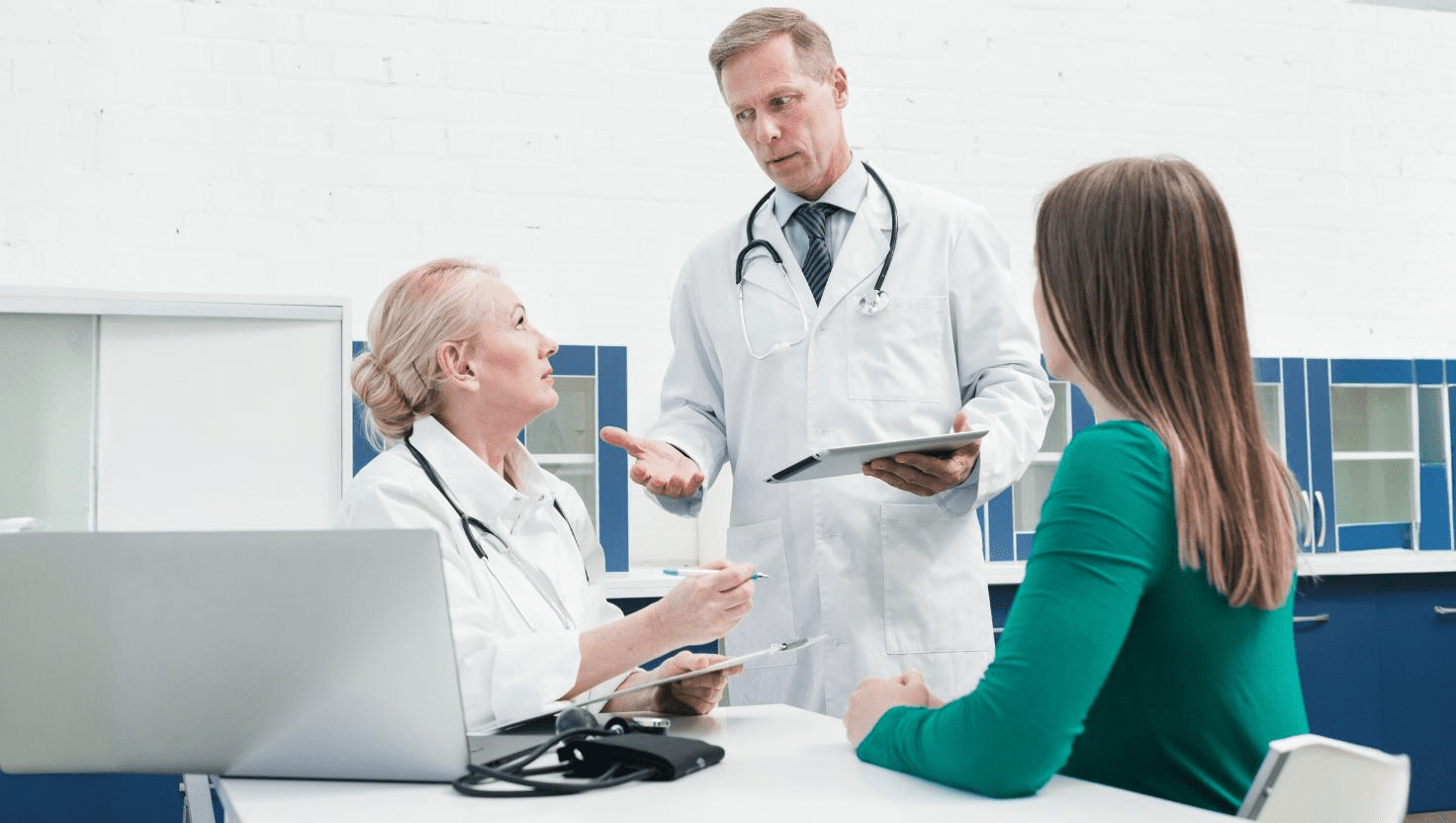 Healthcare professional using advanced medical devices alongside virtual medical assistant tools, illustrating improved patient care and operational efficiency through outsourcing.