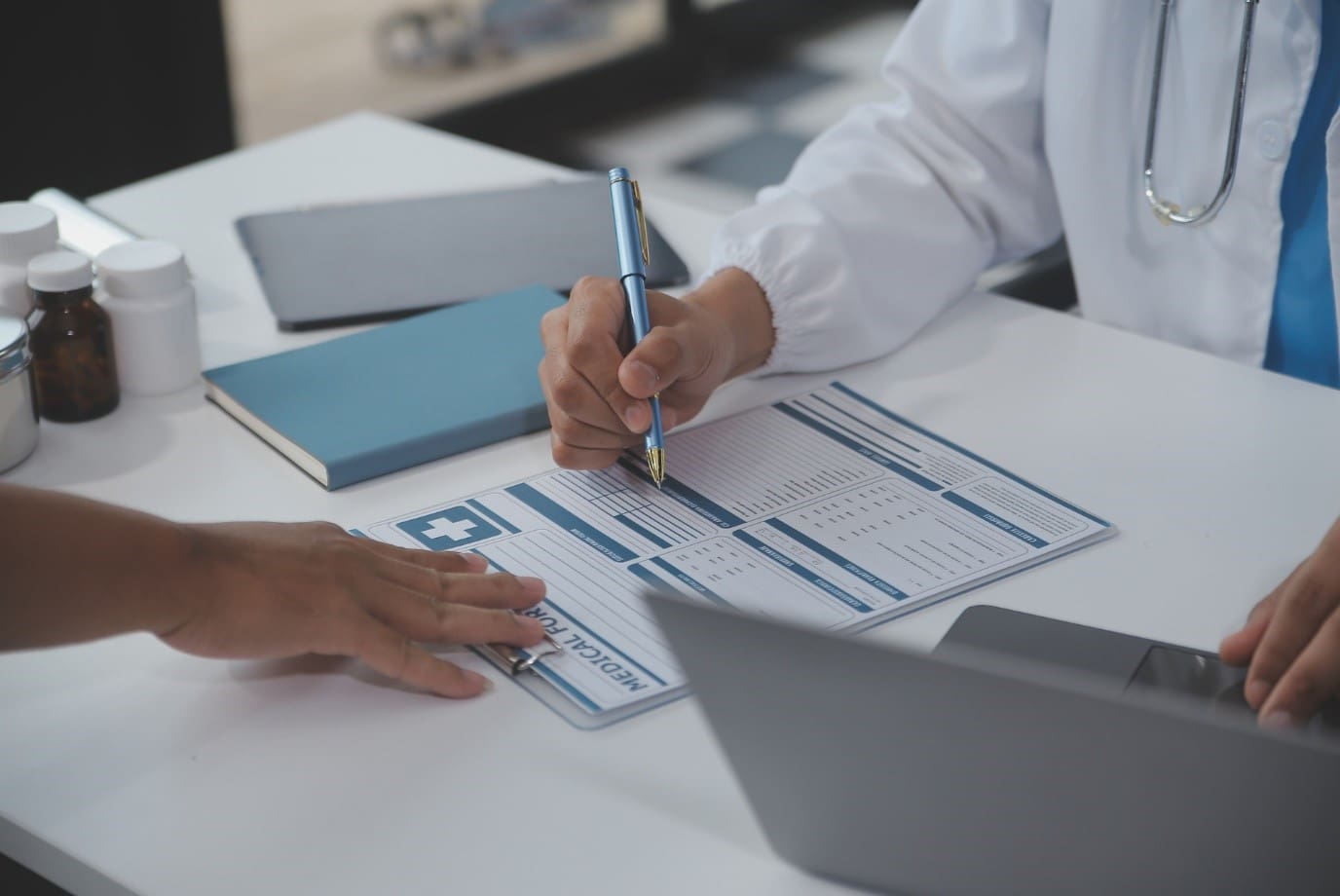 Healthcare outsourcing infographic showcasing benefits like patient care focus, operational efficiency, compliance, and accuracy improvement.