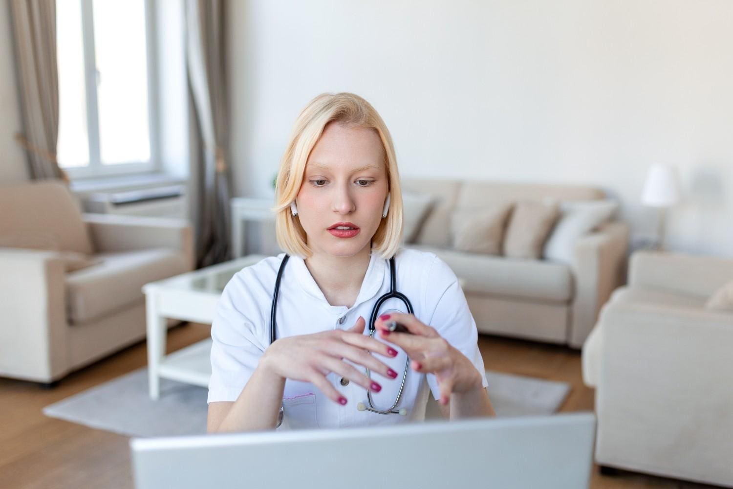 "Virtual medical assistant: Doctor using a laptop to provide telemedicine consultation"