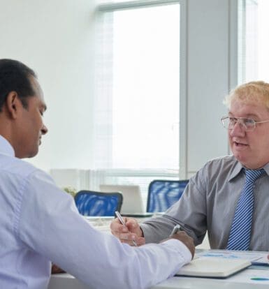 Healthcare professionals discussing solutions to reduce administrative burden and prior authorization challenges.