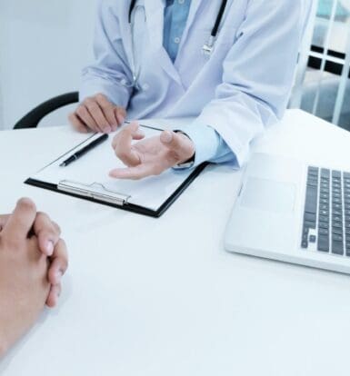 Doctor discussing prior authorization process with a patient in orthopedic practice in Elizabeth, NJ
