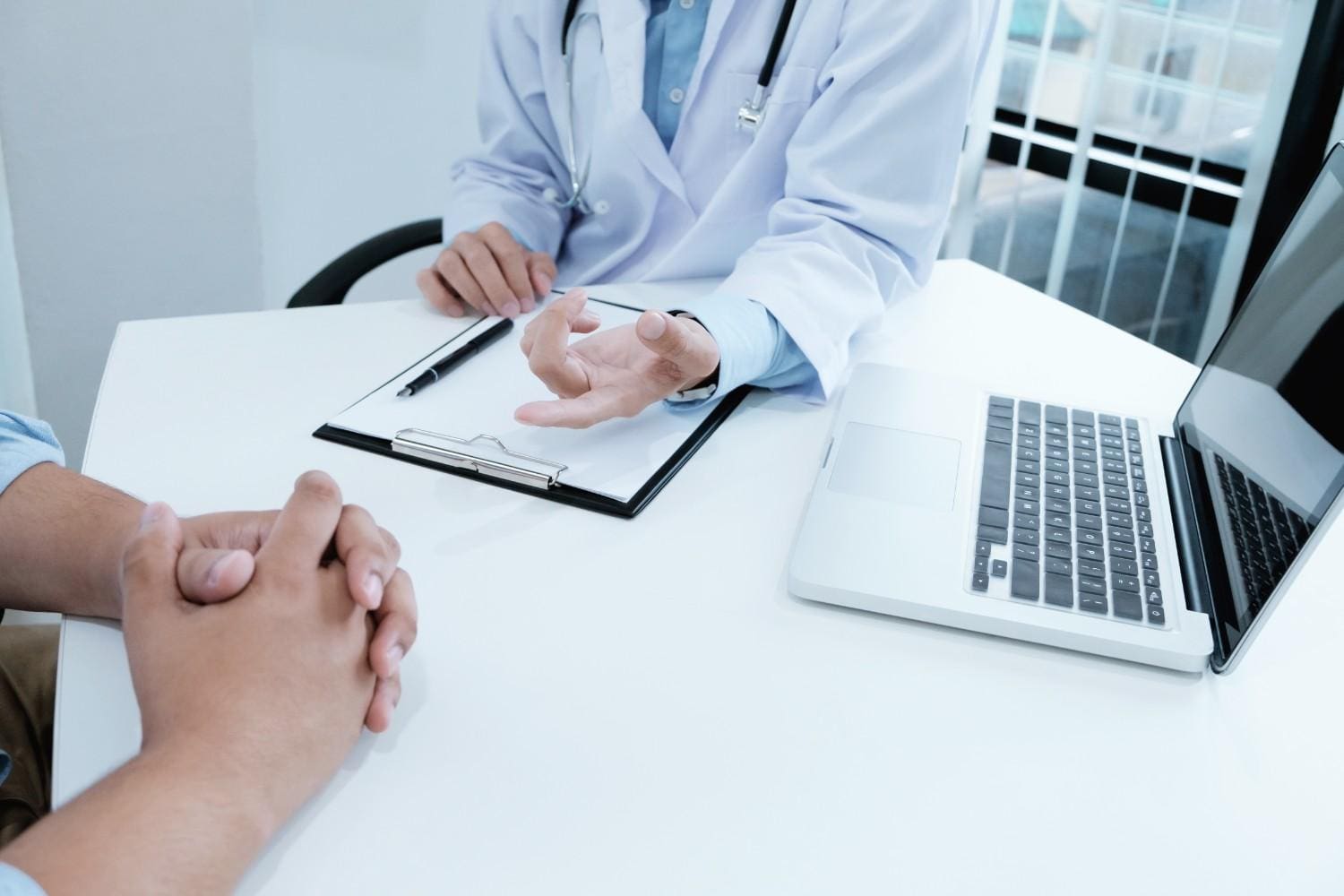 Doctor discussing prior authorization process with a patient in orthopedic practice in Elizabeth, NJ