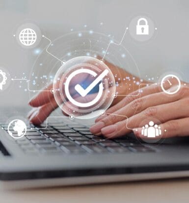 Healthcare professional using a laptop to manage administrative tasks with digital icons for security, time, and productivity.