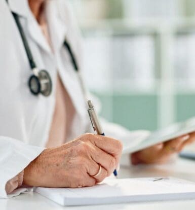 A medical professional using Outsourced Insurance Authorization Services to process prior authorizations efficiently.